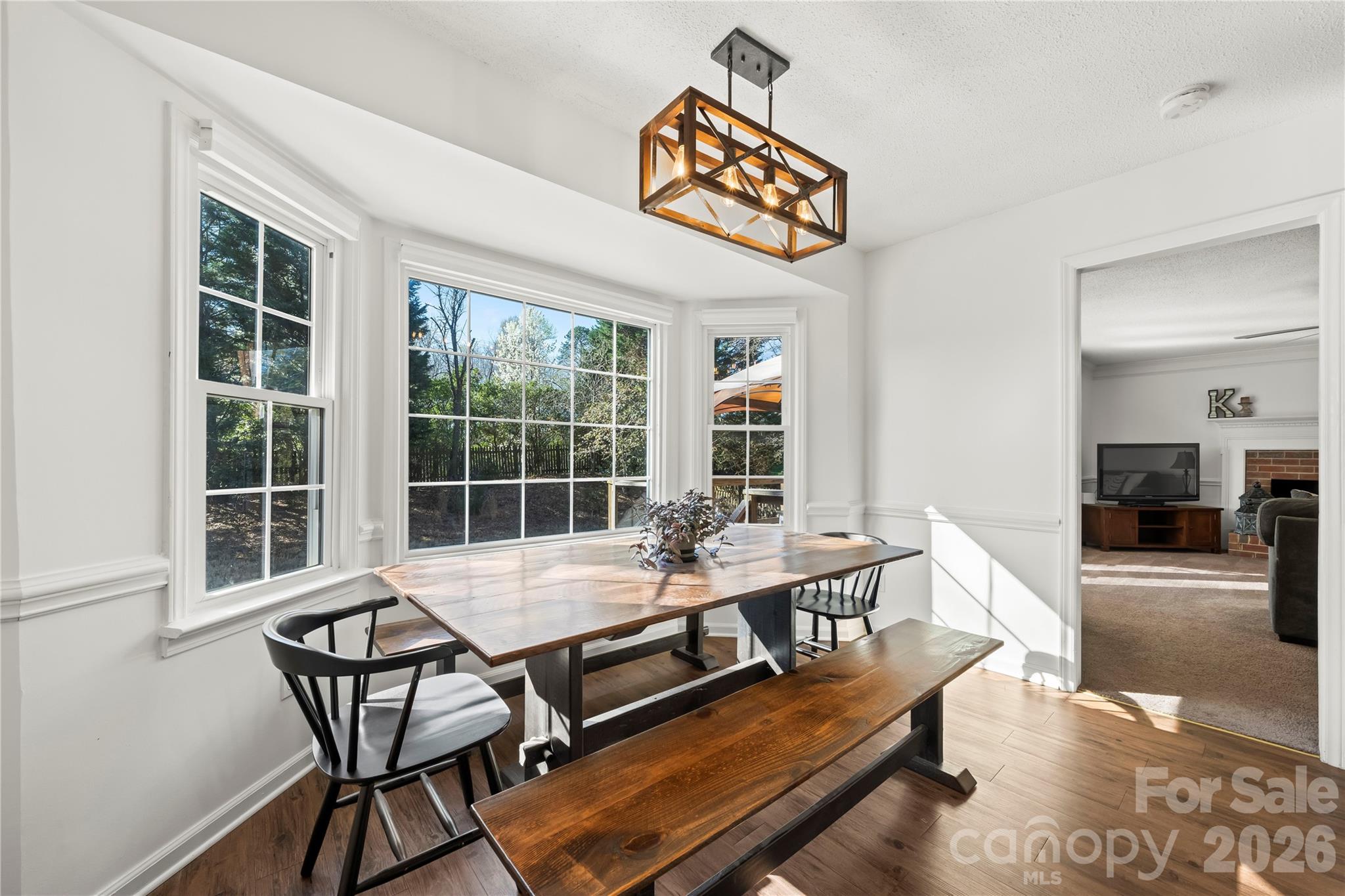6101 Boykin Spaniel Road Charlotte, NC 28277 - Photo 16 of 40 a dining room with furniture a rug and a large window