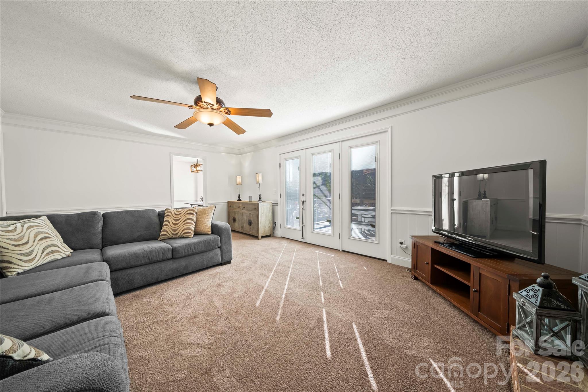 6101 Boykin Spaniel Road Charlotte, NC 28277 - Photo 19 of 40 a living room with furniture and a flat screen tv