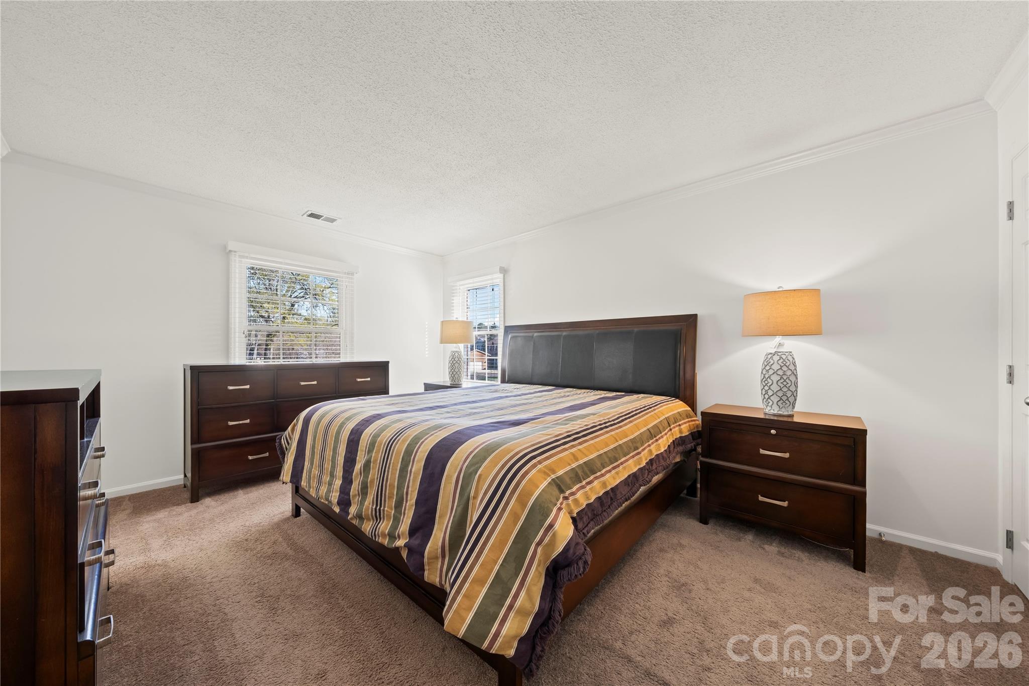 6101 Boykin Spaniel Road Charlotte, NC 28277 - Photo 23 of 40 a bedroom with a bed and lamp