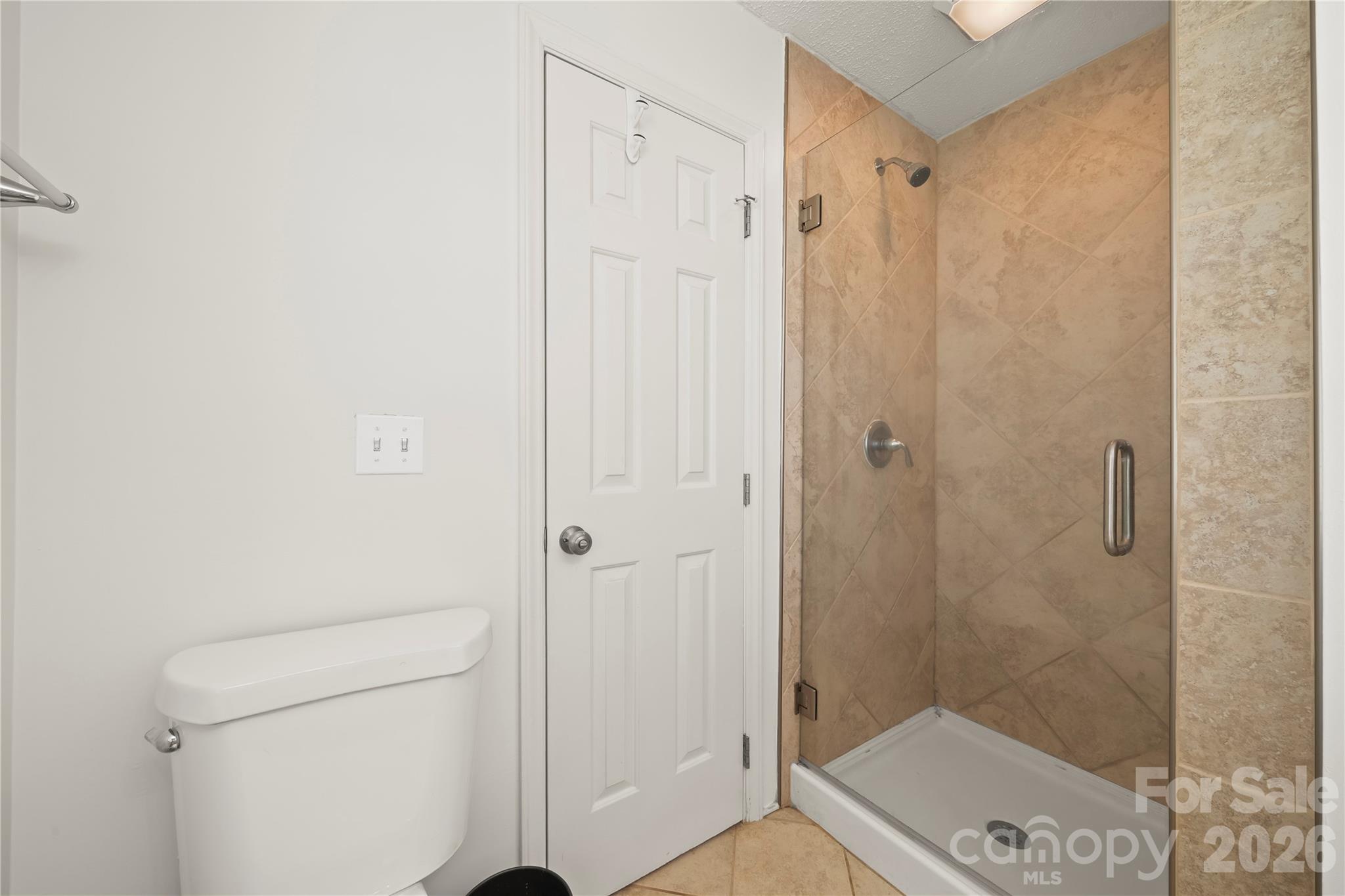 6101 Boykin Spaniel Road Charlotte, NC 28277 - Photo 26 of 40 a bathroom with a shower and a toilet