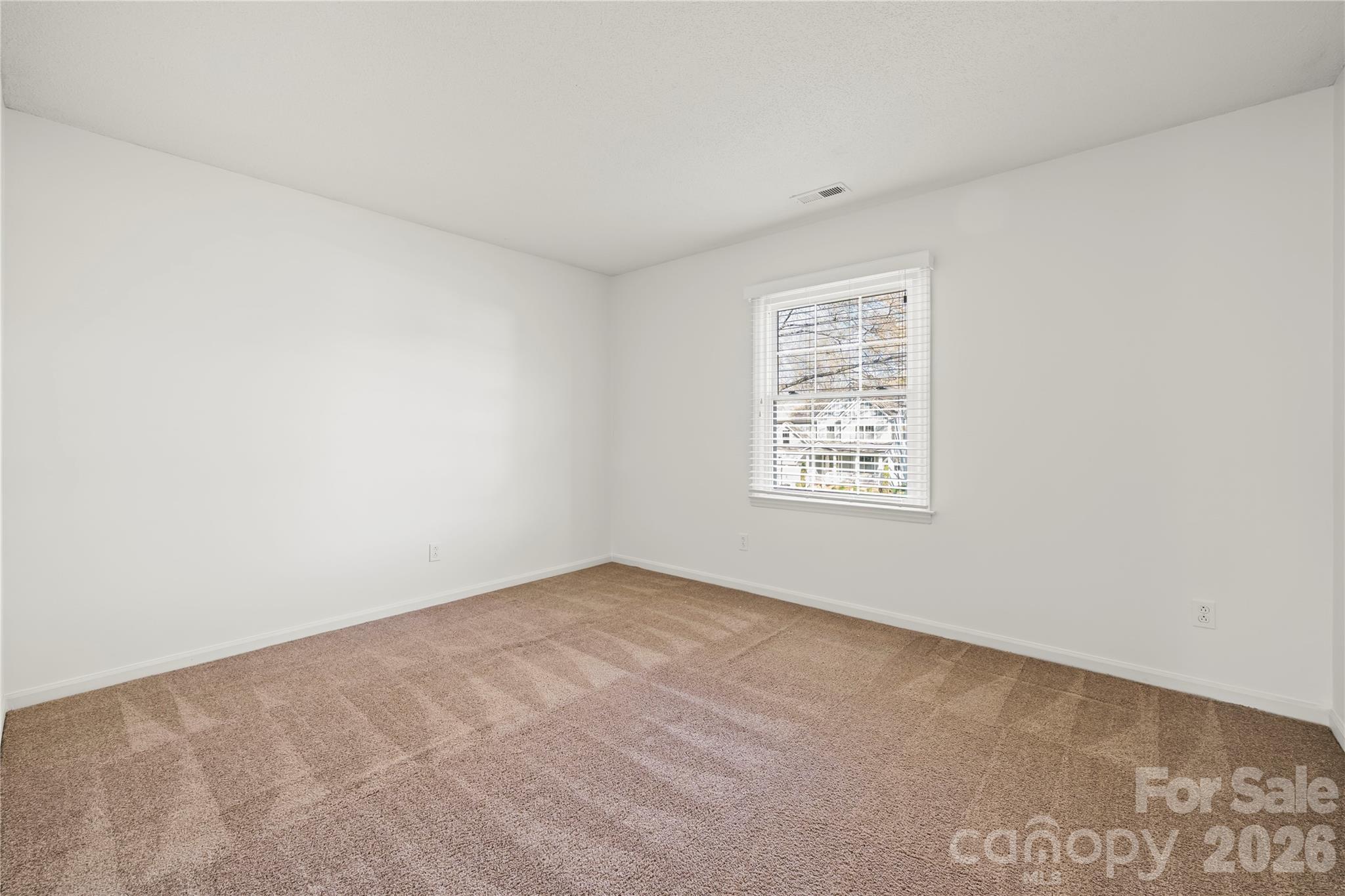 6101 Boykin Spaniel Road Charlotte, NC 28277 - Photo 31 of 40 an empty room with a window