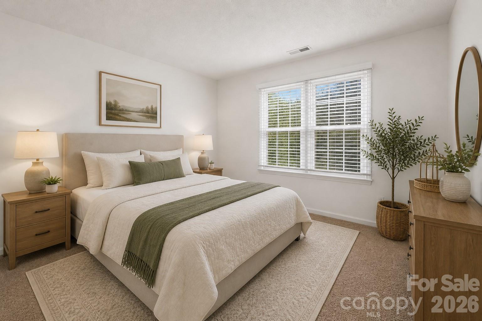 6101 Boykin Spaniel Road Charlotte, NC 28277 - Photo 33 of 40 a bedroom with a bed and a potted plant