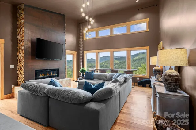 a living room with fireplace furniture and a flat screen tv