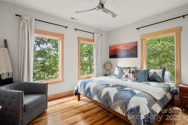 a bedroom with a bed and a couch