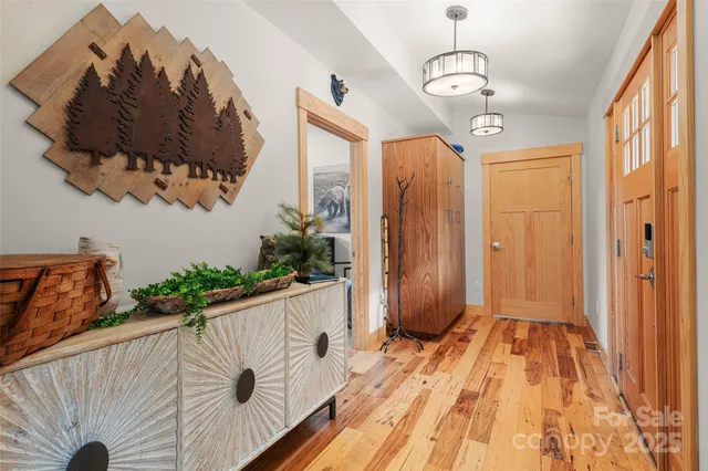 a view of a hallway with dining area