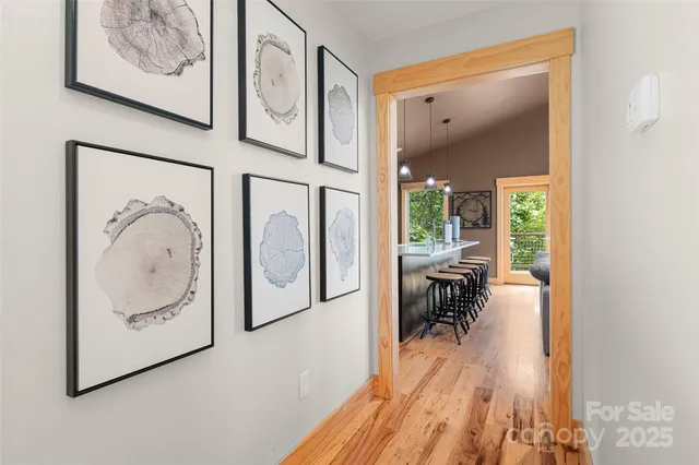 a view of a living room with furniture and a large window