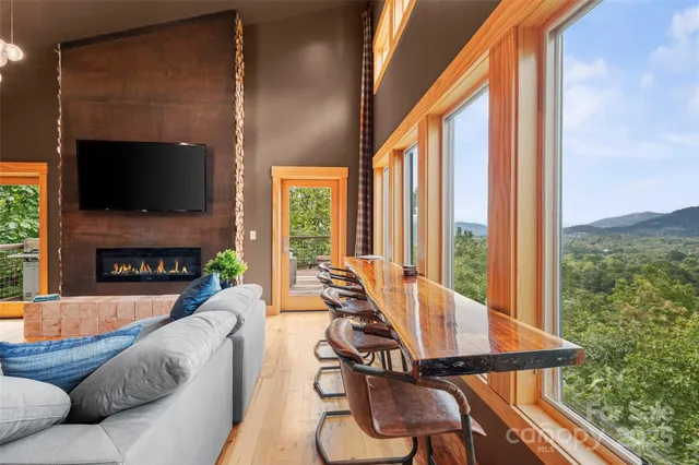 a living room with fireplace furniture and a flat screen tv