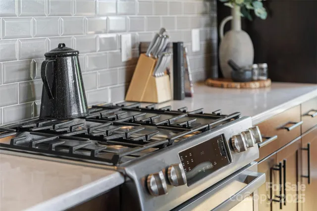 a close view of a stove and a wooden floor