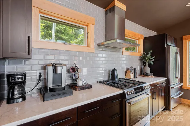 a kitchen with a stove and a sink