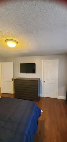 a bedroom with bed and window