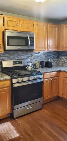 a view of a livingroom with furniture and wooden floor