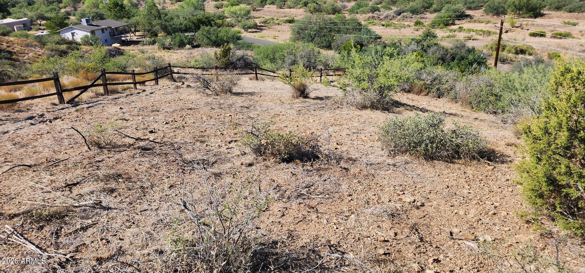 19872 East Antelope Road, Unit A Cordes Lakes, AZ 86333 - Photo 7 of 17 a view of a dry yard with wooden fence