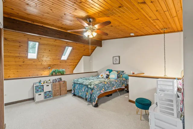 a bedroom with bed and window