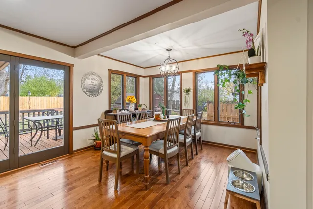 a view of a dining room with furniture window and wooden floor
