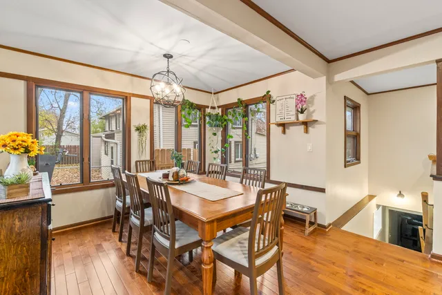 a view of a dining room with furniture window and wooden floor
