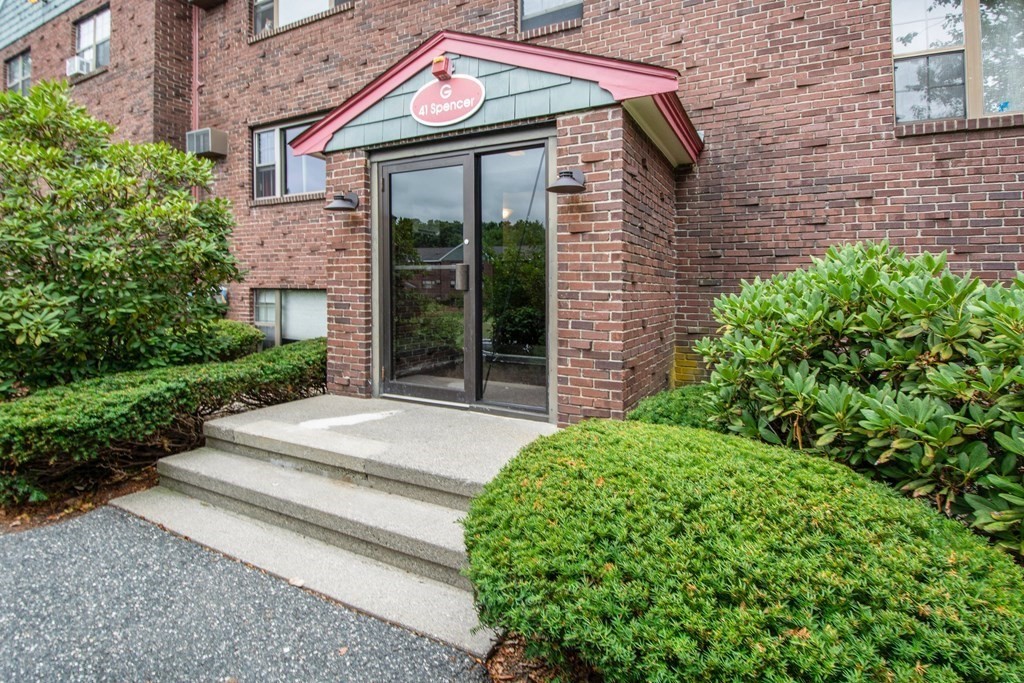 41 Spencer Road, Unit G16 Boxborough, MA 01719 - Photo 1 of 17 a front view of a house with garden
