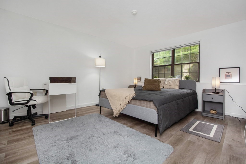 41 Spencer Road, Unit G16 Boxborough, MA 01719 - Photo 12 of 17 a bedroom with a bed chair and a window