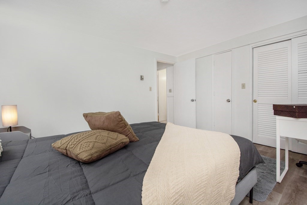 41 Spencer Road, Unit G16 Boxborough, MA 01719 - Photo 14 of 17 a bedroom with a bed and couch chair