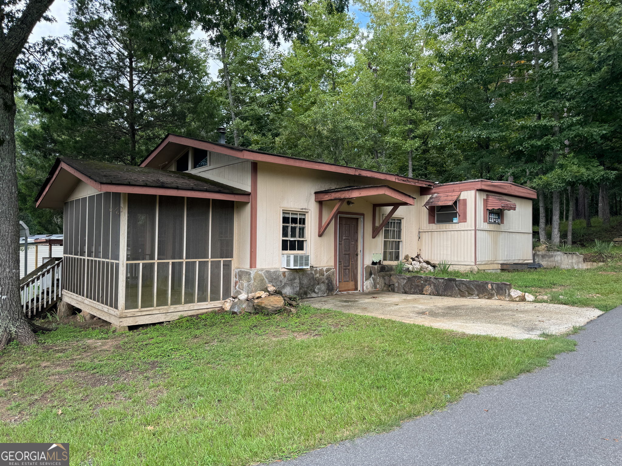 868 South Steel Bridge Road Eatonton, GA 31024 - Photo 54 of 64 a view of a house with a yard and sitting area