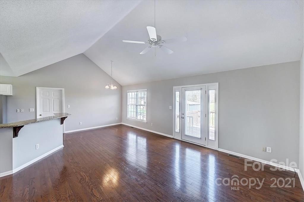 4103 Watson Church Road Monroe, NC 28110 - Photo 7 of 28 a view of an empty room with window and wooden floor