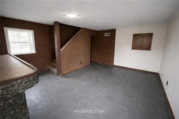 a view of an empty room with windows