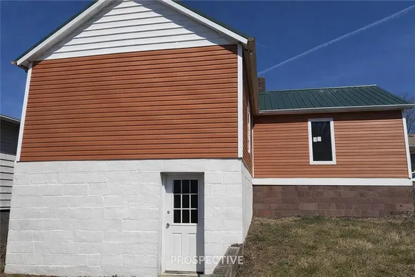 a front view of a house with a garage