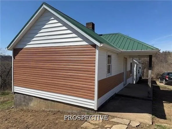a view of a two room with wooden floor