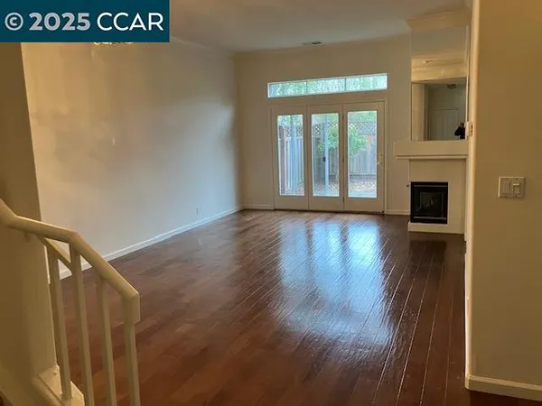 a view of front door with wooden floor