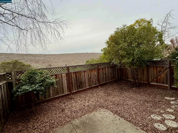 a view of a backyard of the house