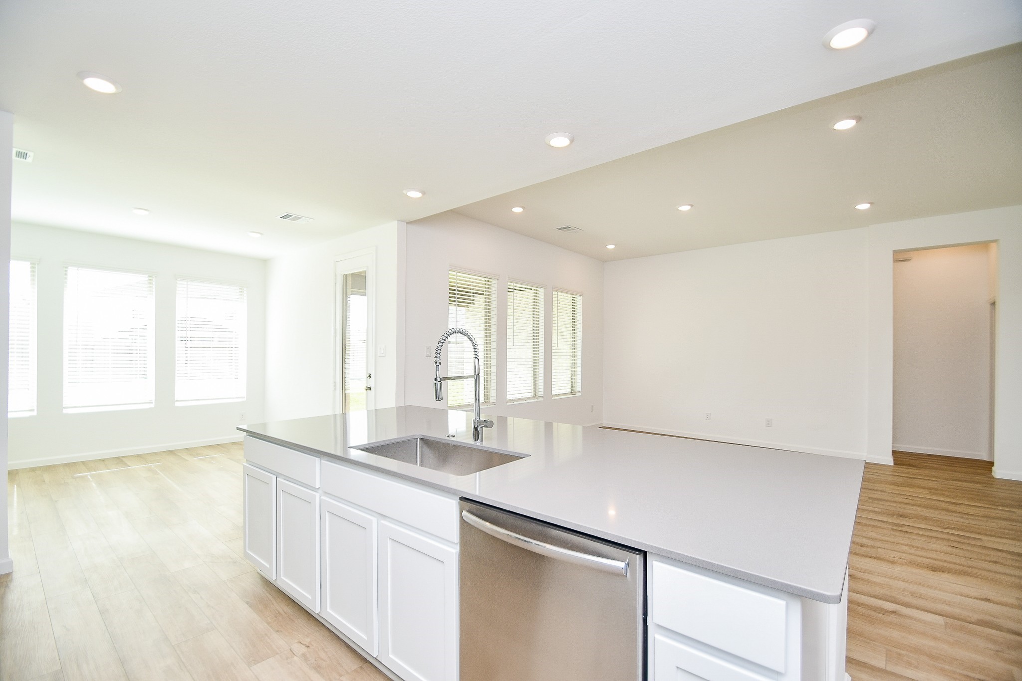5624 Frst Cv Drive Rosenberg, TX 77469 - Photo 26 of 32 a large kitchen with stainless steel appliances a large counter top a sink and a wooden floor