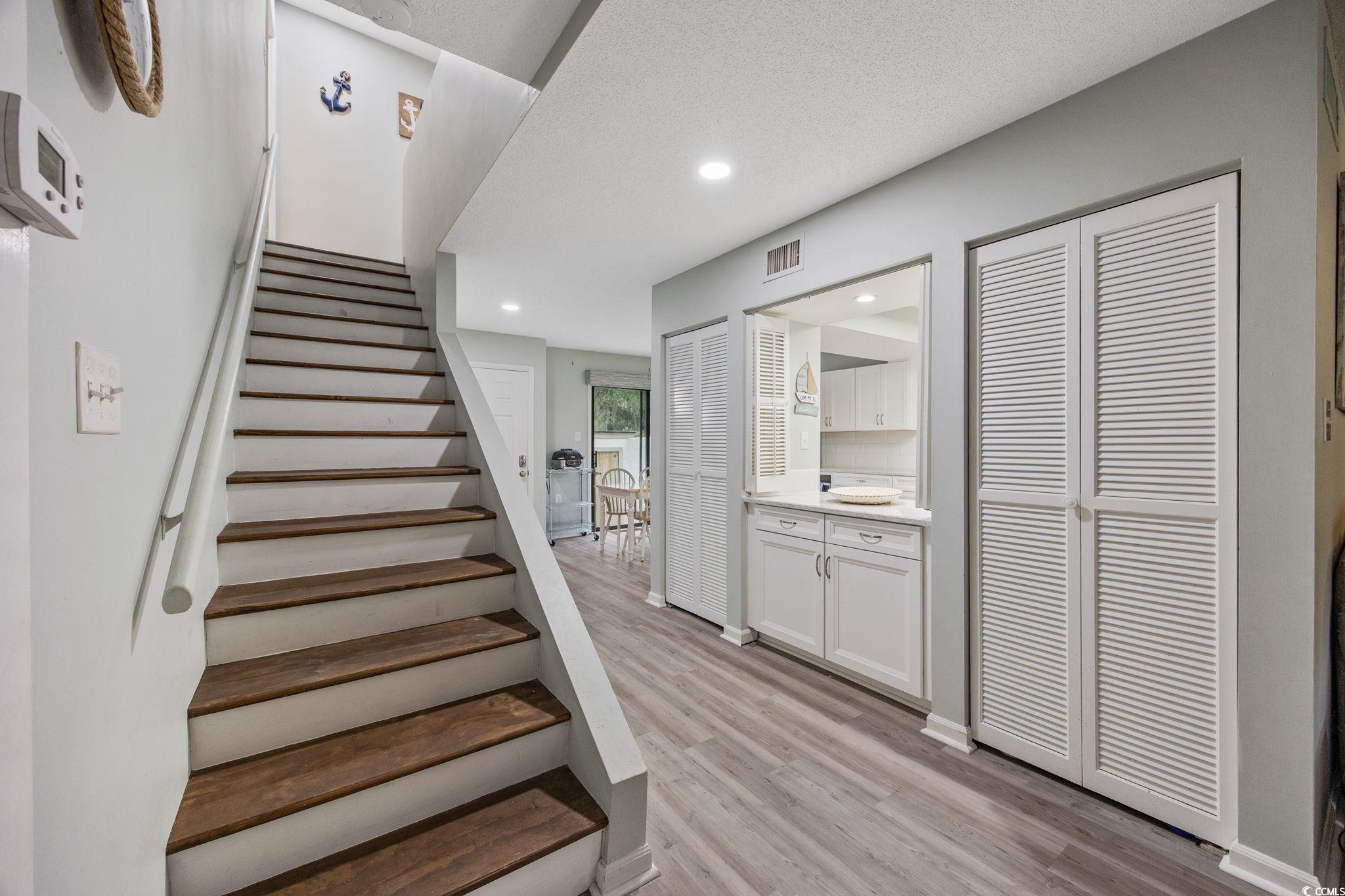 64 Bamboo Loop, Unit 161 Georgetown, SC 29440 - Photo 14 of 31 Stairway featuring wood finished floors and recessed lighting