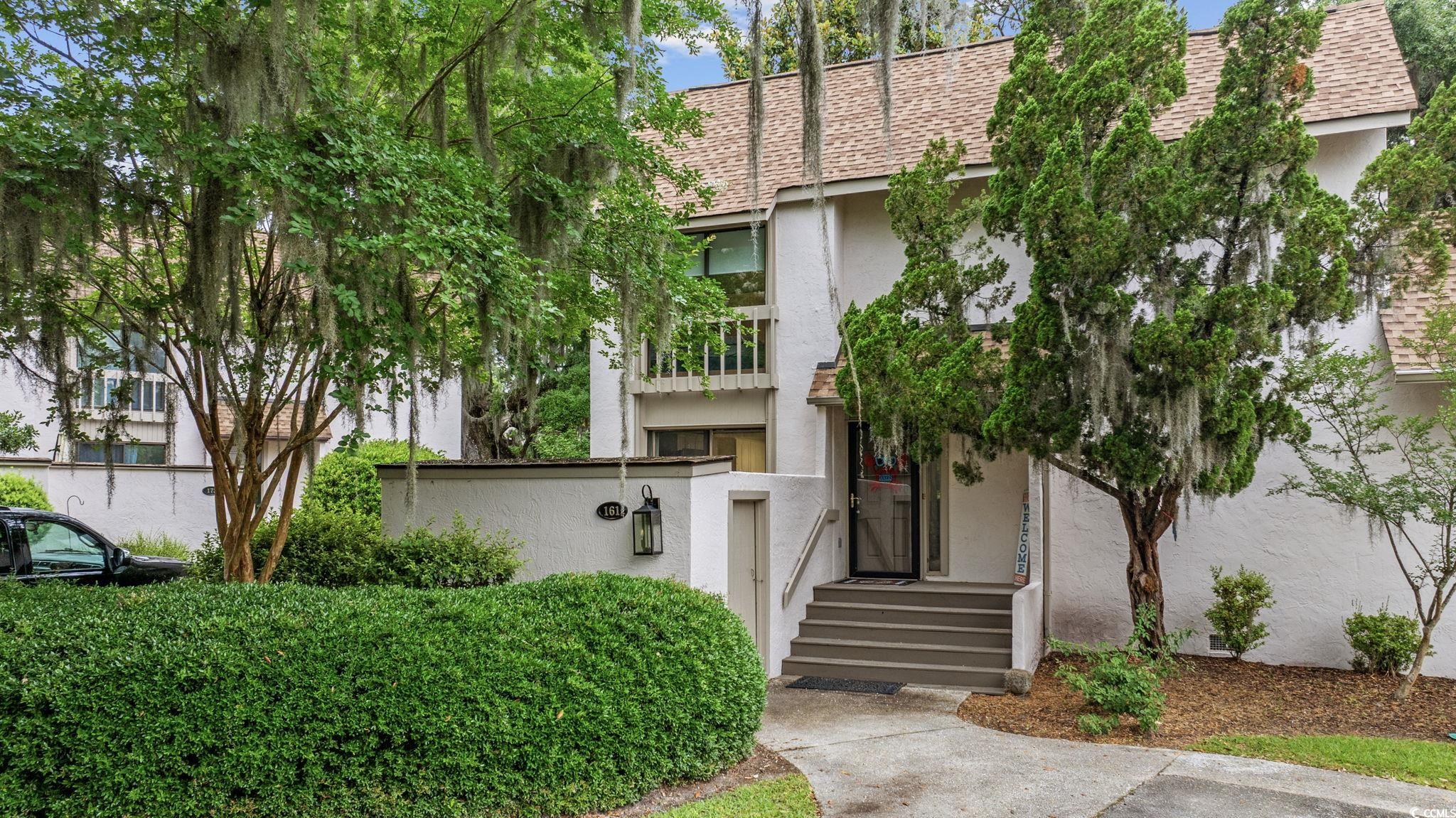 64 Bamboo Loop, Unit 161 Georgetown, SC 29440 - Photo 5 of 31 View of front facade with roof with shingles and stucco siding