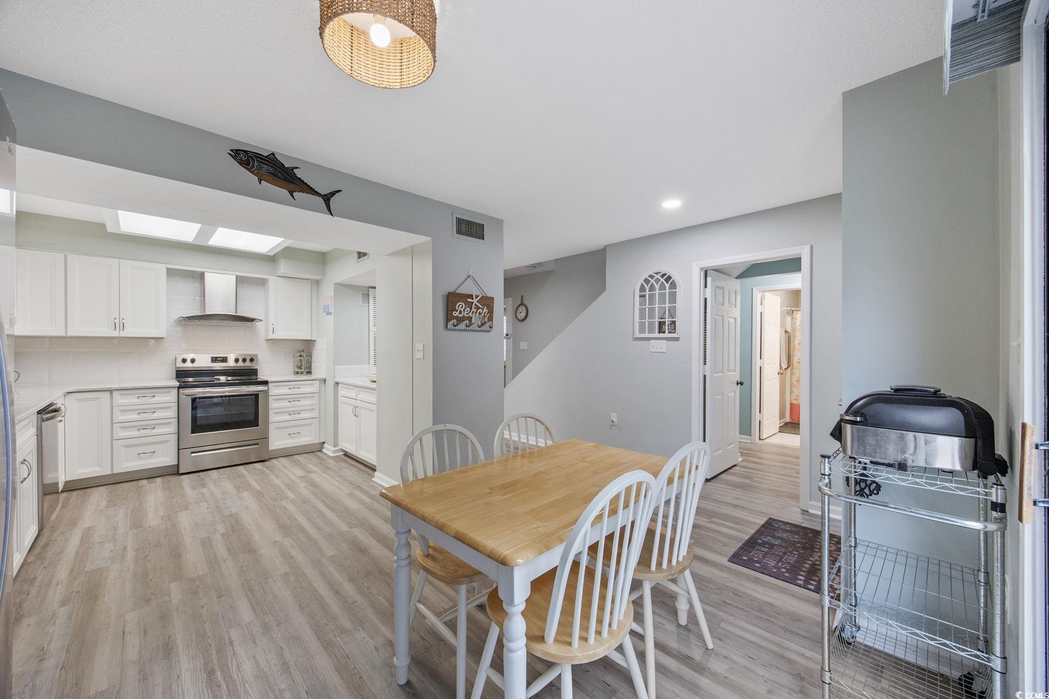 64 Bamboo Loop, Unit 161 Georgetown, SC 29440 - Photo 10 of 31 Dining room featuring light wood-style floors, recessed lighting, and baseboards