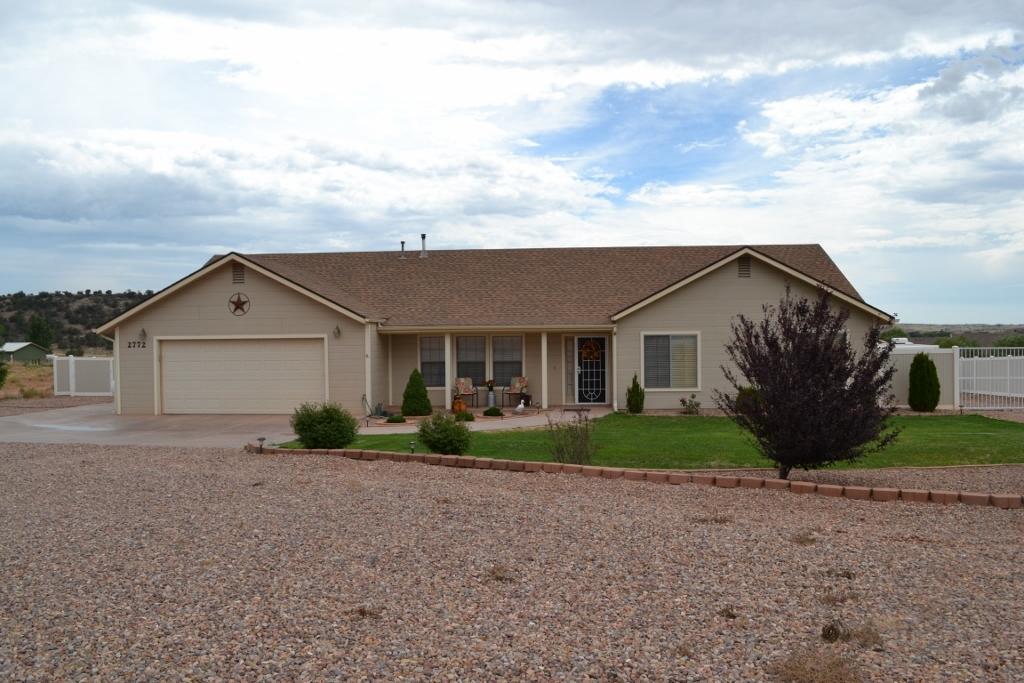 2772 Mason Ridge Road Show Low, AZ 85901 - Photo 1 of 51 a view of a house next to a yard and garage
