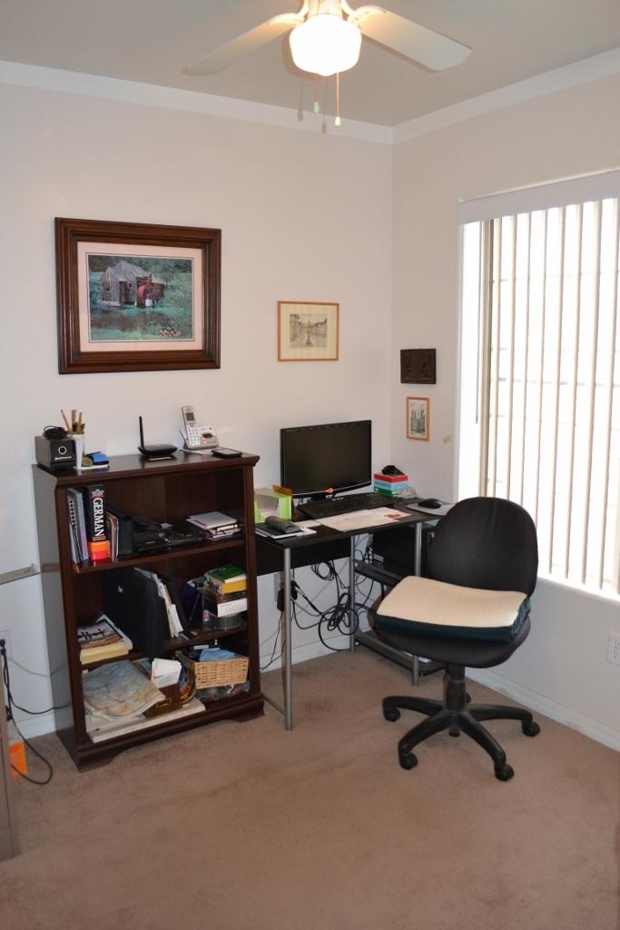 2772 Mason Ridge Road Show Low, AZ 85901 - Photo 14 of 51 a view of a workspace with furniture and a window