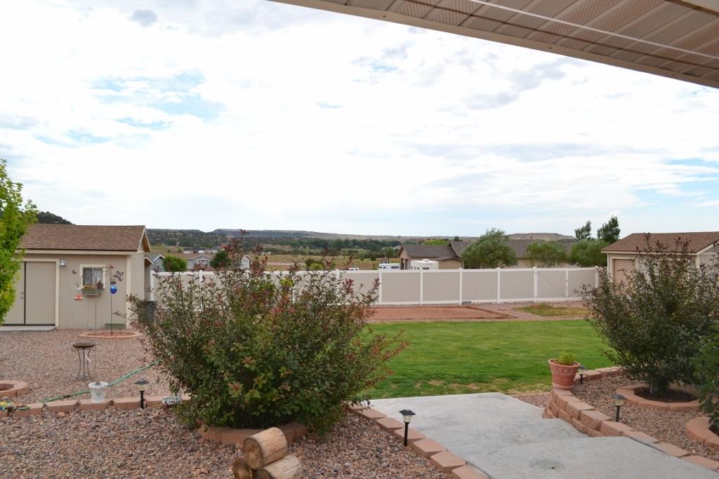 2772 Mason Ridge Road Show Low, AZ 85901 - Photo 29 of 51 a view of a garden with a building in the background