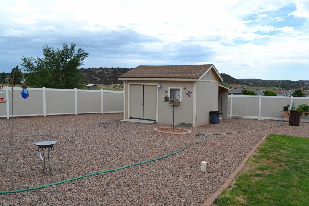 2772 Mason Ridge Road Show Low, AZ 85901 - Photo 30 of 51 a view of a house with a yard