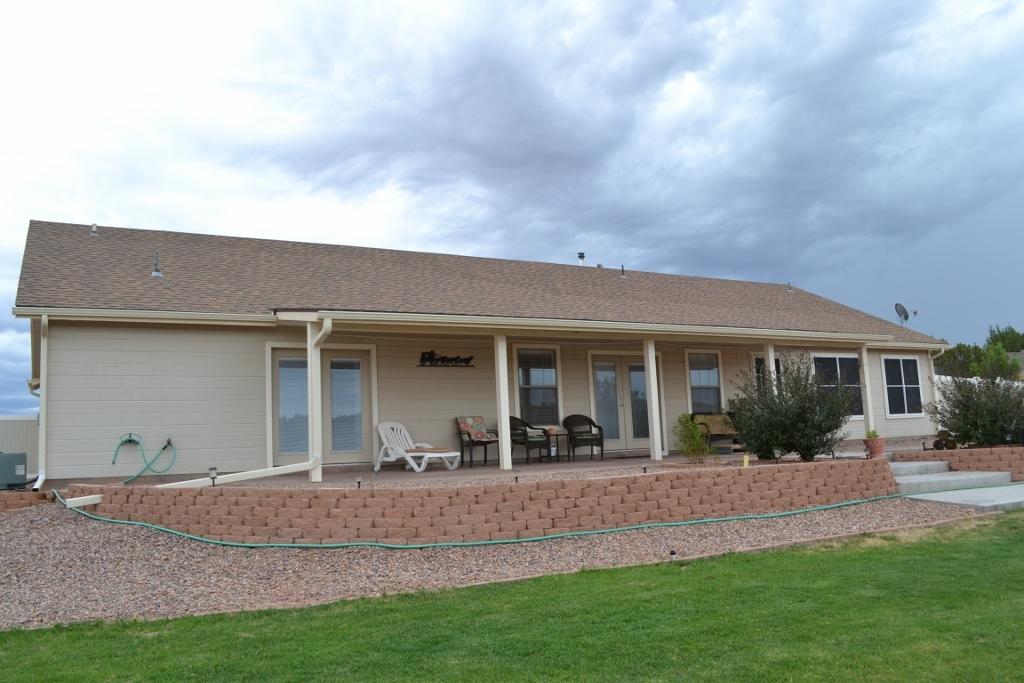 2772 Mason Ridge Road Show Low, AZ 85901 - Photo 34 of 51 a view of a house with a backyard