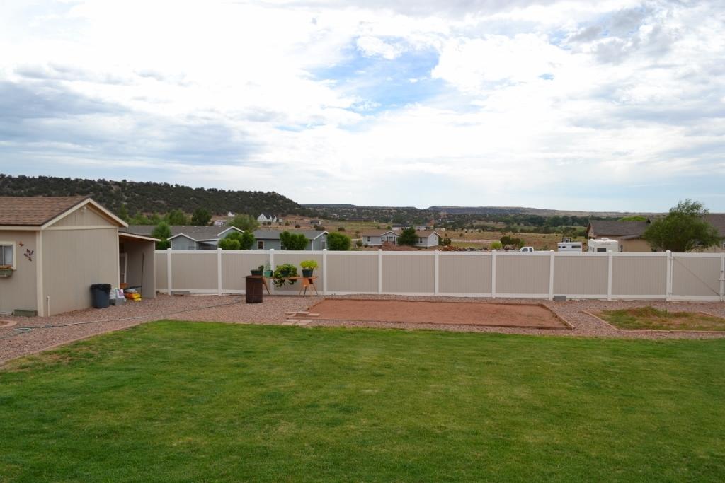 2772 Mason Ridge Road Show Low, AZ 85901 - Photo 41 of 51 a view of a house with a big yard and sitting area