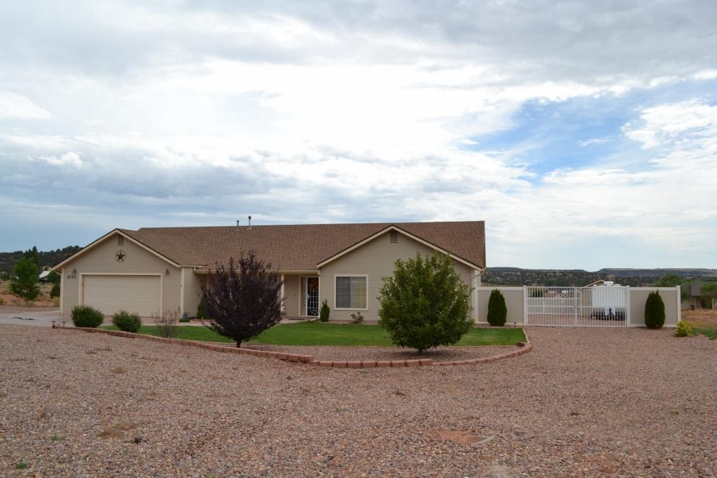 2772 Mason Ridge Road Show Low, AZ 85901 - Photo 47 of 51 a view of a house with wooden fence next to a road