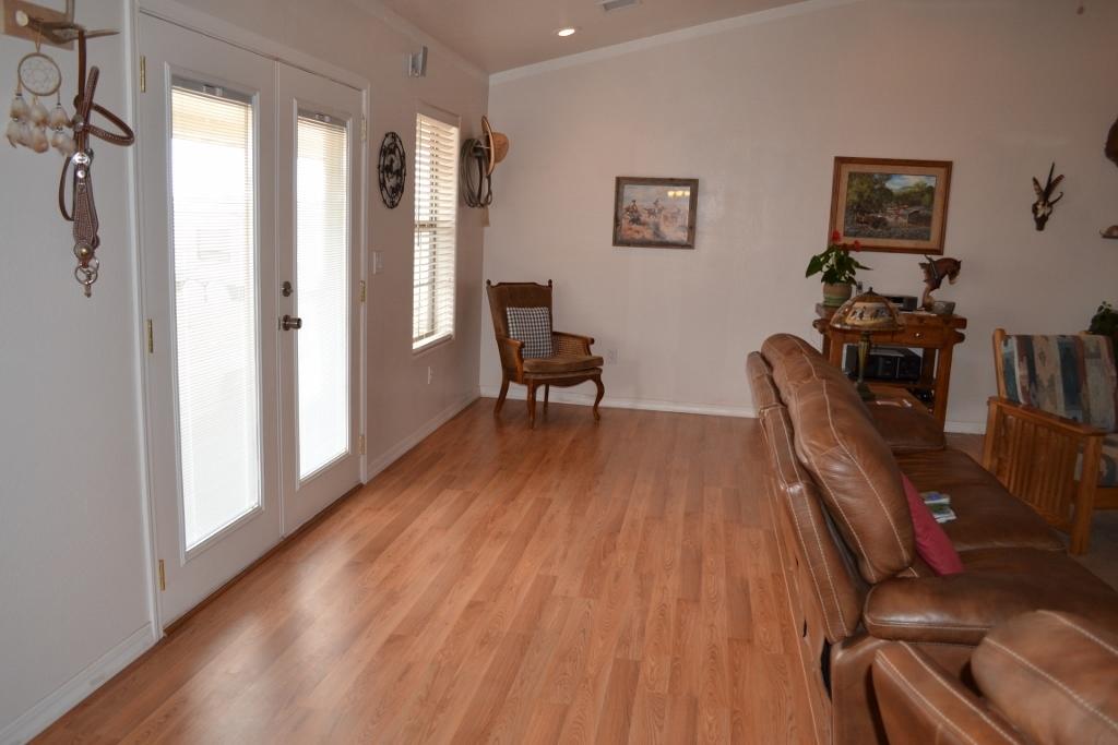 2772 Mason Ridge Road Show Low, AZ 85901 - Photo 5 of 51 a view of a livingroom with furniture wooden floor and a window
