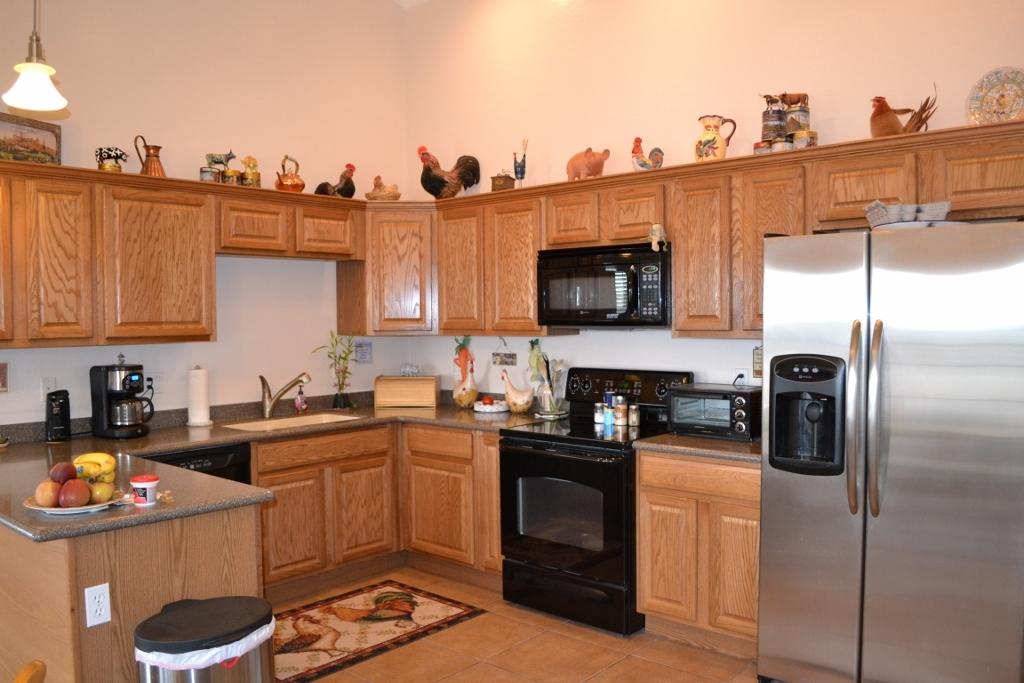 2772 Mason Ridge Road Show Low, AZ 85901 - Photo 8 of 51 a kitchen with stainless steel appliances a sink a stove a refrigerator cabinets and a counter top space