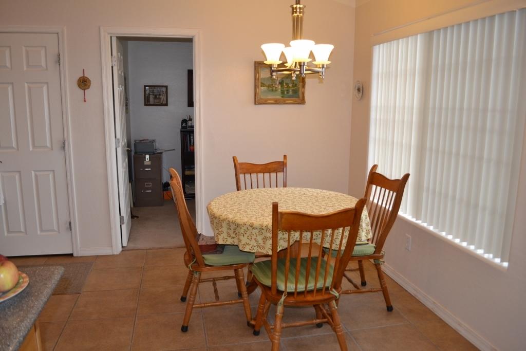 2772 Mason Ridge Road Show Low, AZ 85901 - Photo 10 of 51 a view of a dining room with furniture and chandelier