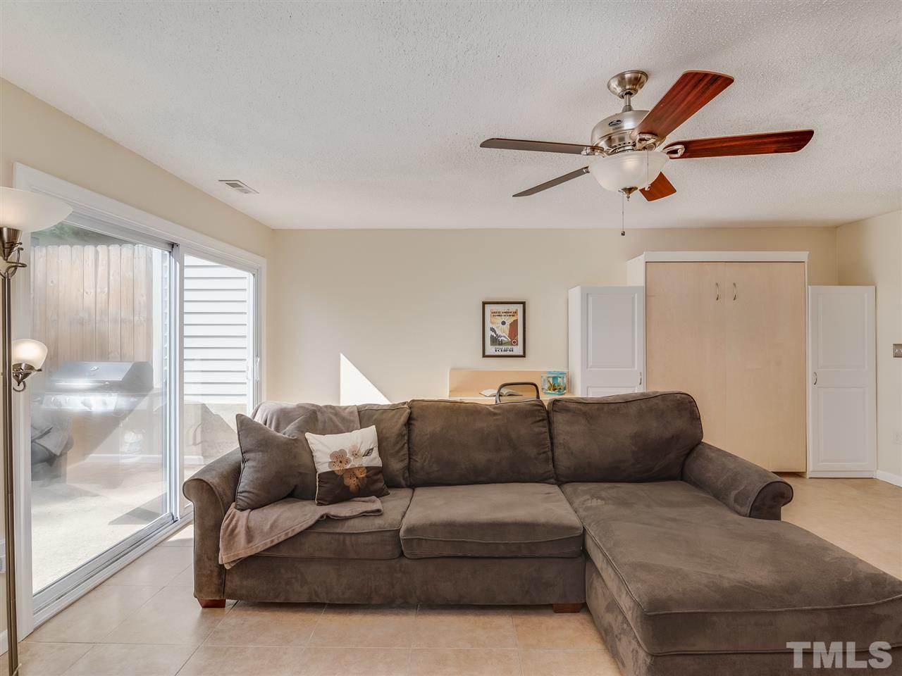 5932 Shady Grove Circle Raleigh, NC 27609 - Photo 14 of 28 a living room with furniture and a large window