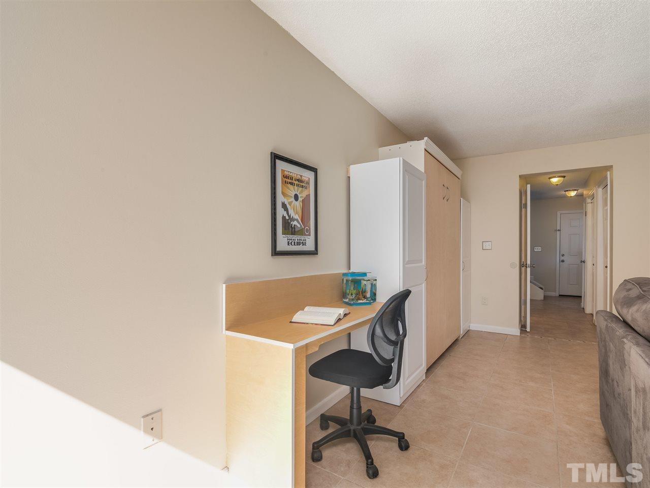 5932 Shady Grove Circle Raleigh, NC 27609 - Photo 15 of 28 a view of a workspace with furniture and a window