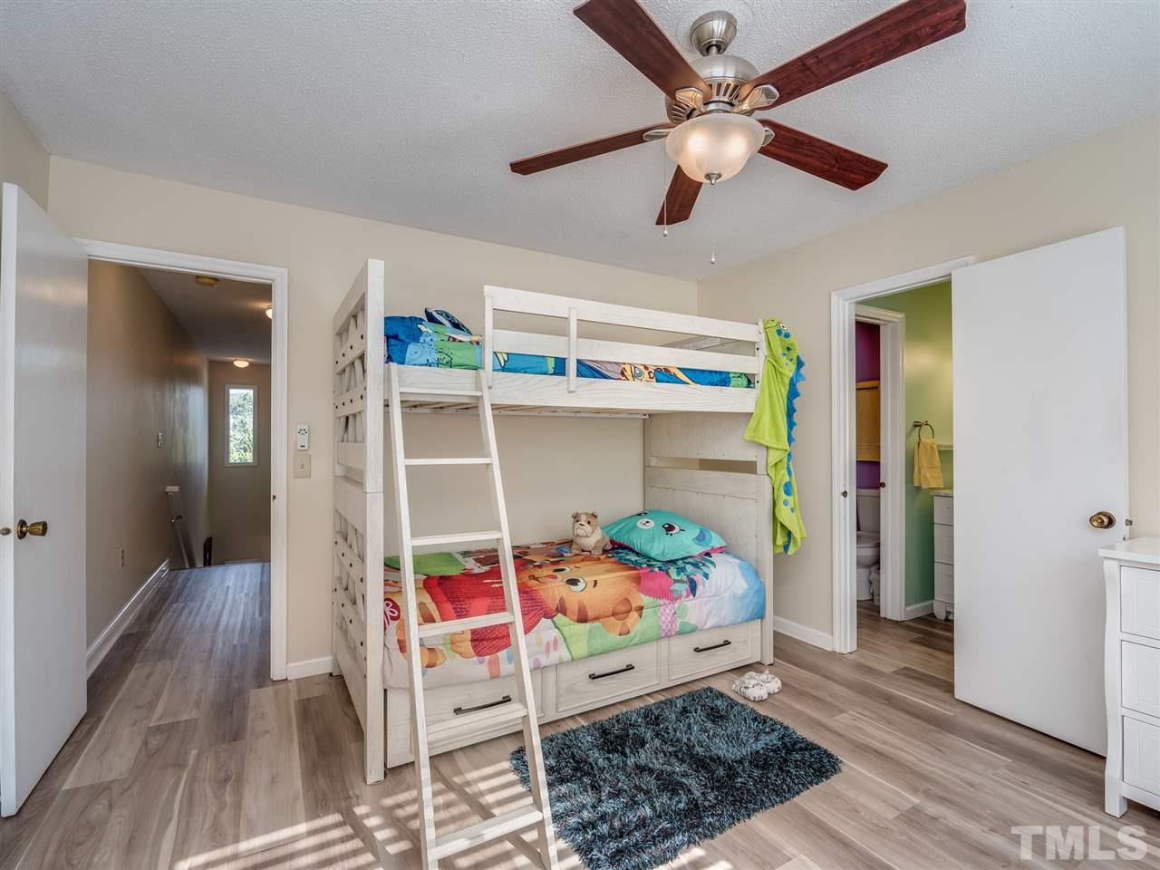 5932 Shady Grove Circle Raleigh, NC 27609 - Photo 23 of 28 a room with furniture and wooden floor