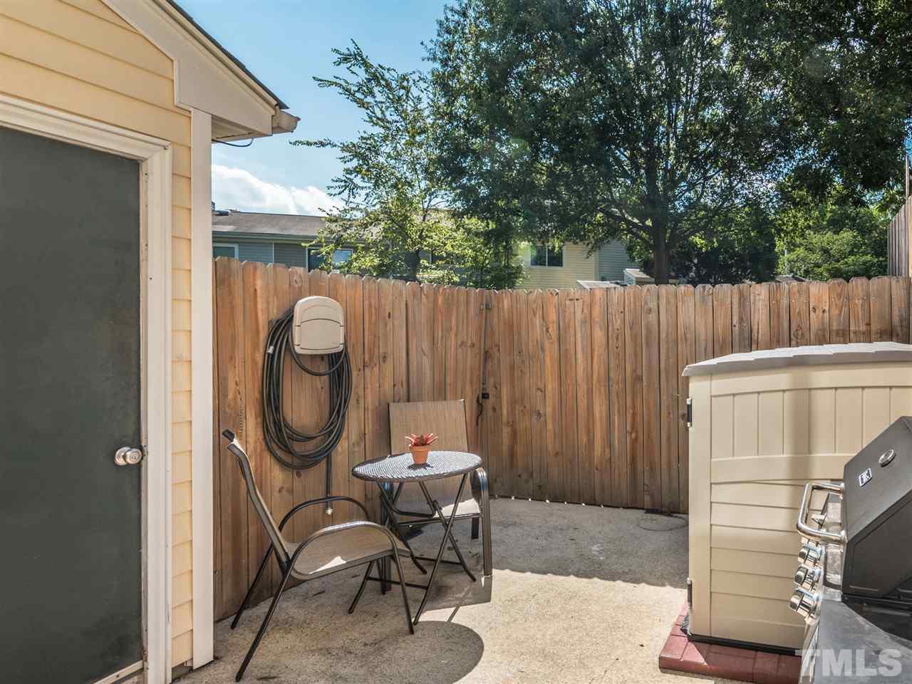 5932 Shady Grove Circle Raleigh, NC 27609 - Photo 27 of 28 a patio with table and chairs