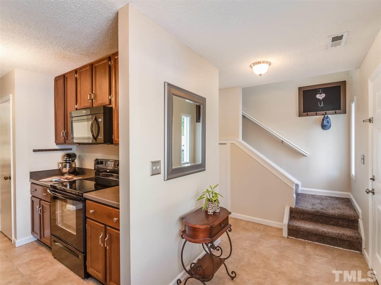5932 Shady Grove Circle Raleigh, NC 27609 - Photo 9 of 28 a kitchen that has a sink and a stove in it