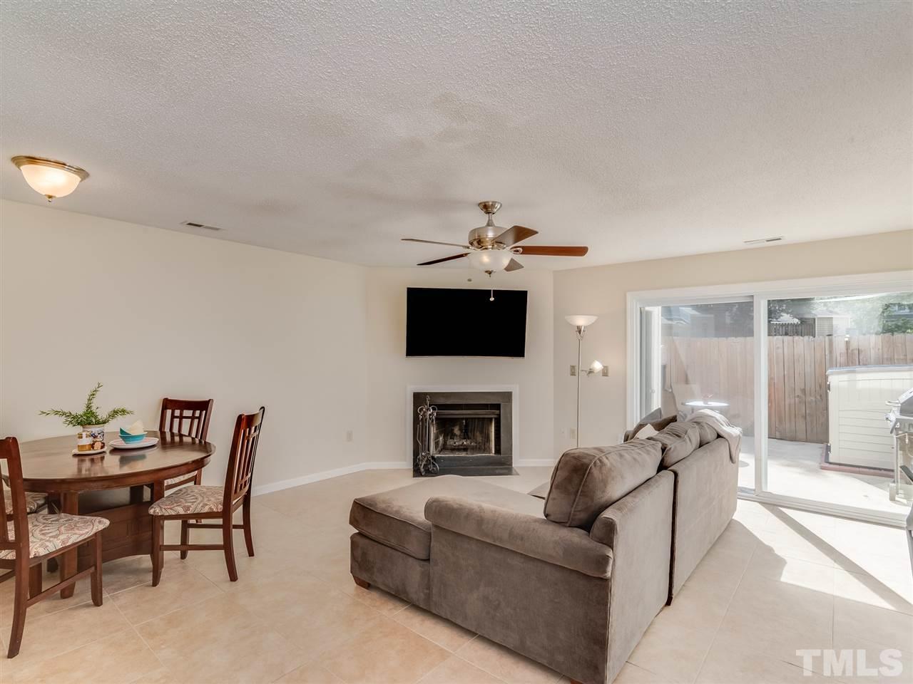 5932 Shady Grove Circle Raleigh, NC 27609 - Photo 10 of 28 a living room with furniture and a fireplace