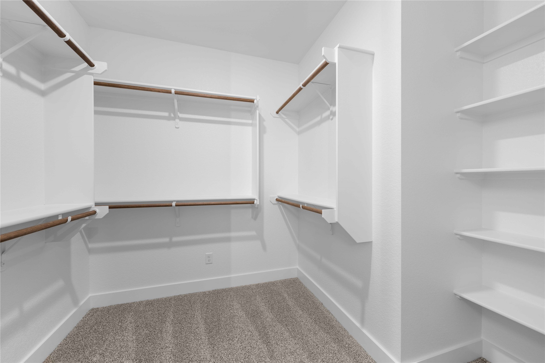 520 Vale Pond Spur Georgetown, TX 78633 - Photo 12 of 32 a view of walk in closet with empty racks